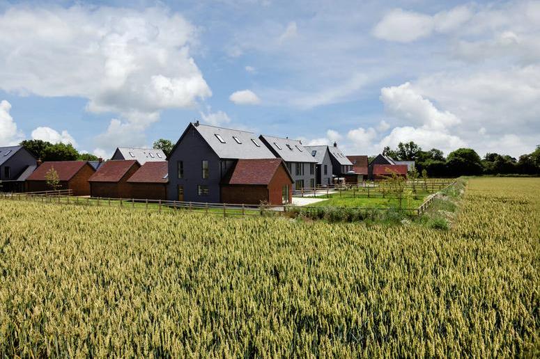 a new housing development on green belt land near aggricultural field