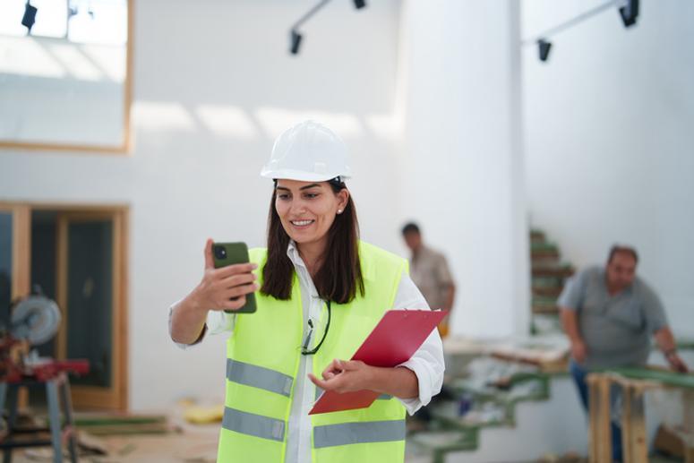 Builder filming social media post onsite