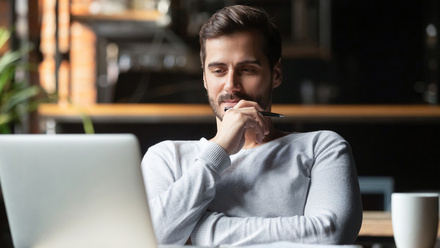 iStock-Man watching webinar.jpg