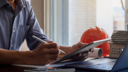 iStock Licence man laptop hard hat.jpg