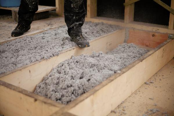 Spreading loose fill cellulose insulation - made from recycled paper